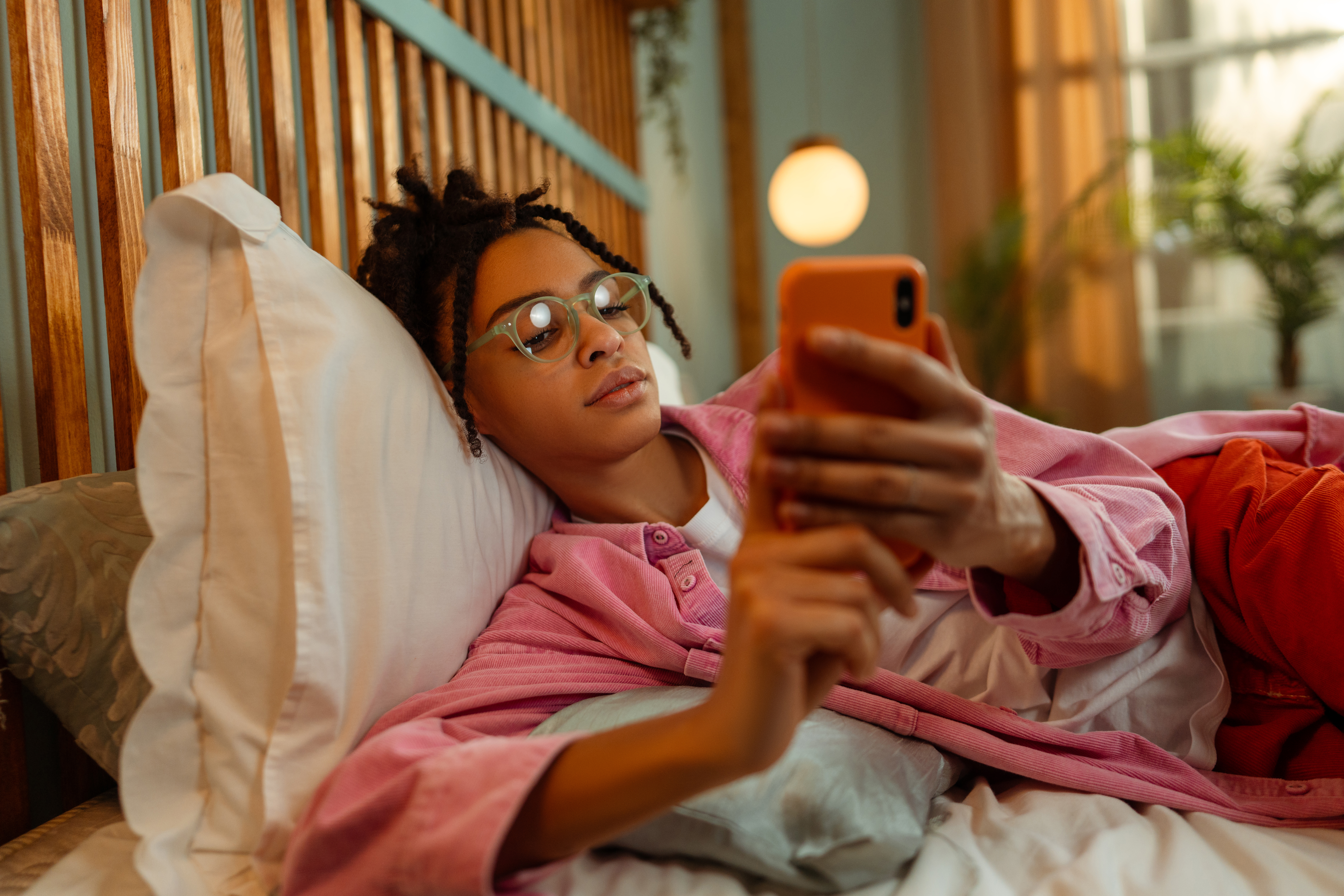 Woman relaxing and using her phone
